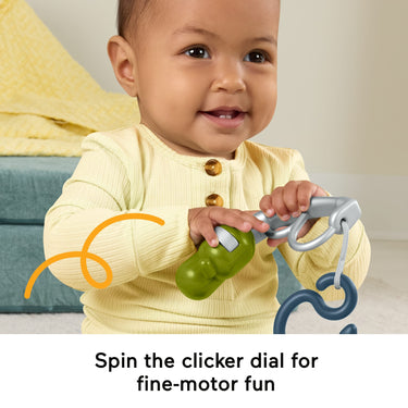 Baby turning the clicker dial on the Reel Fun Fishing pole
