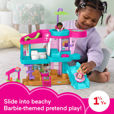 Child playing with the Little People Barbie Beach House and figures, labeled for ages 1.5 years and up