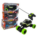Rev Rollers Climbing King RC rock crawler with remote in front of stacked boxes