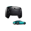 Back of the remote control and rear view of the green Aston Martin Vantage RC car