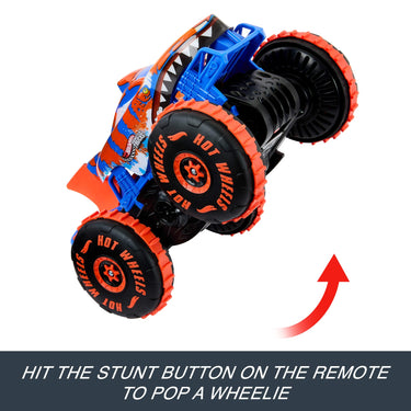 Tiger Shark Climber RC truck popping a wheelie with text about the remote's stunt button