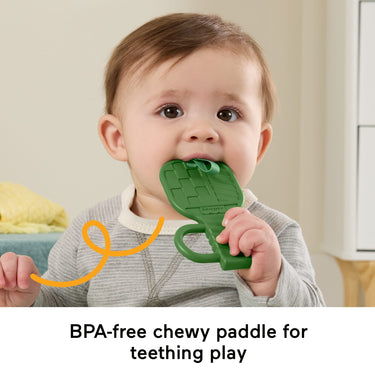 Baby chewing the green BPA-free teether paddle