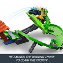 Monster truck launching into the collapsed dragon's mouth on the Dragon Destruction playset