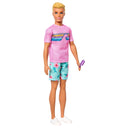 Ken doll in a pink graphic t-shirt, floral shorts and white sneakers holding a frozen treat