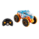 Hot Wheels RC Rhinomite monster truck in blue and orange with its remote control