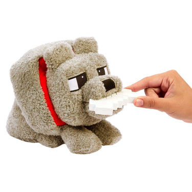 Hand feeding the bone accessory to the Minecraft Dennis wolf plush