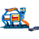 Hot Wheels Turbo Jet Car Wash playset in blue with rollers and an orange ramp, shown with a blue Hot Wheels car