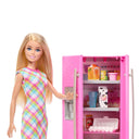 Close-up of Barbie doll opening the pink fridge with food, milk and eggs on the shelves