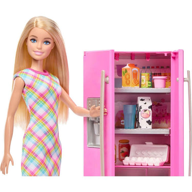 Barbie doll reaching into the hot-pink refrigerator with its door open