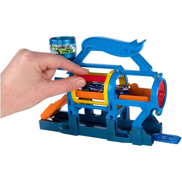 Hand pushing a car through the rollers of the Turbo Jet Car Wash playset