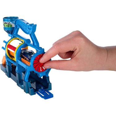 Hand turning the red wheel on the side of the Turbo Jet Car Wash playset