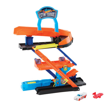 Hot Wheels City Transforming Stunt Garage in garage mode with orange ramps, multi-level parking and two toy cars