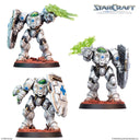 Three painted white Terran Medic StarCraft miniatures with shields