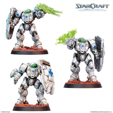 Three painted white Terran Medic StarCraft miniatures with shields
