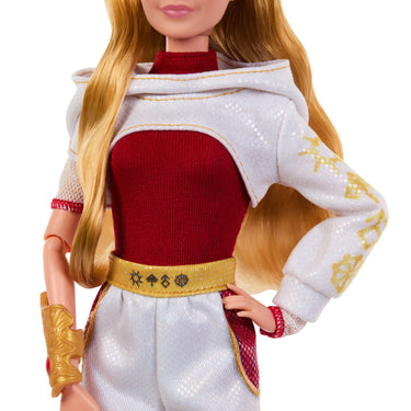 Close-up of Nova Bright doll's white hooded jacket, red top, gold belt and gold arm cuff