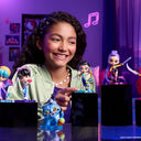 Smiling girl displaying KPop Demon Hunters collectible figures on stands