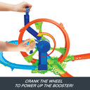 Hand cranking the wheel to power the booster on the Rapid Launch & Loop playset