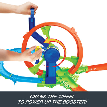 Hand cranking the wheel to power the booster on the Rapid Launch & Loop playset
