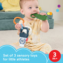 Baby chewing the teether paddle while holding the crinkle water bottle, labeled set of 3 sensory toys for ages 3 months and up