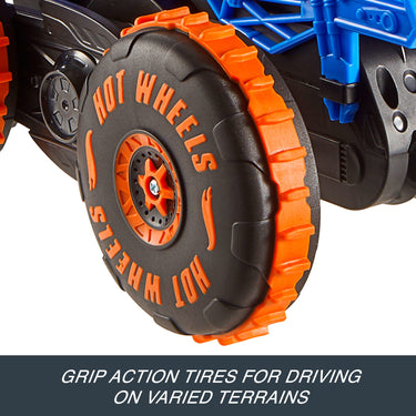 Close-up of the Tiger Shark Climber RC truck's orange and black Grip Action Tire