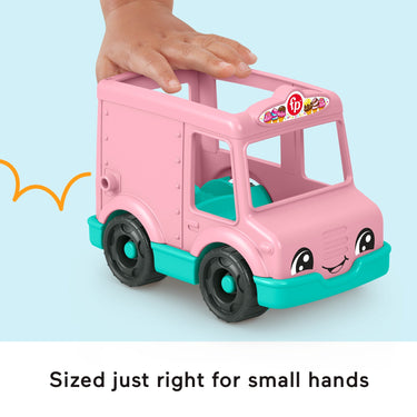 Small hand resting on the roof of the pink Little People ice cream truck