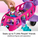 Hand placing a Little People figure into a seat on the Barbie Little Dream Plane filled with figures