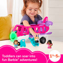 Toddler playing with the Little People Barbie Little Dream Plane and its figures