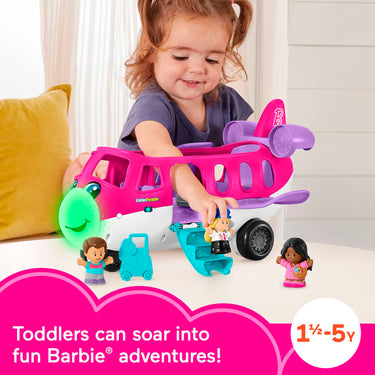 Toddler playing with the Little People Barbie Little Dream Plane and its figures