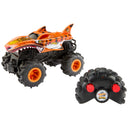 Hot Wheels RC Tiger Shark monster truck shown with its black tire-shaped remote