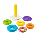 Giant Rock-a-Stack base and post with six colorful rings laid out, including a clear ring with beads inside