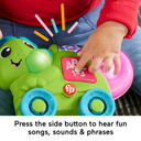Hand pressing the side button on the Link Squad Chameleon toy